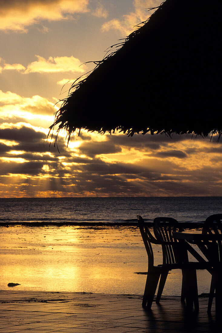 Deck Chair and Umbrella Sunset Silhouette,The Edgewater Resort, Rarotonga, Cook Islands