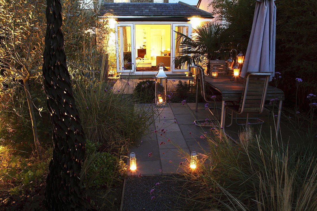 A garden lit with lanterns