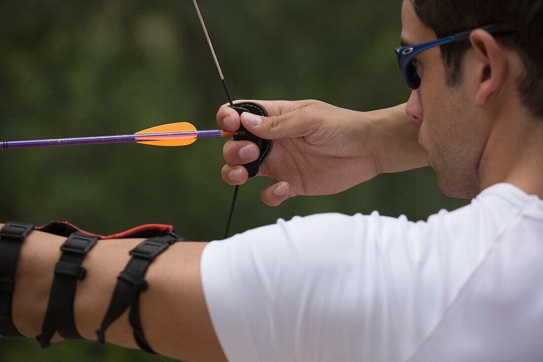 Archer taking aim at target