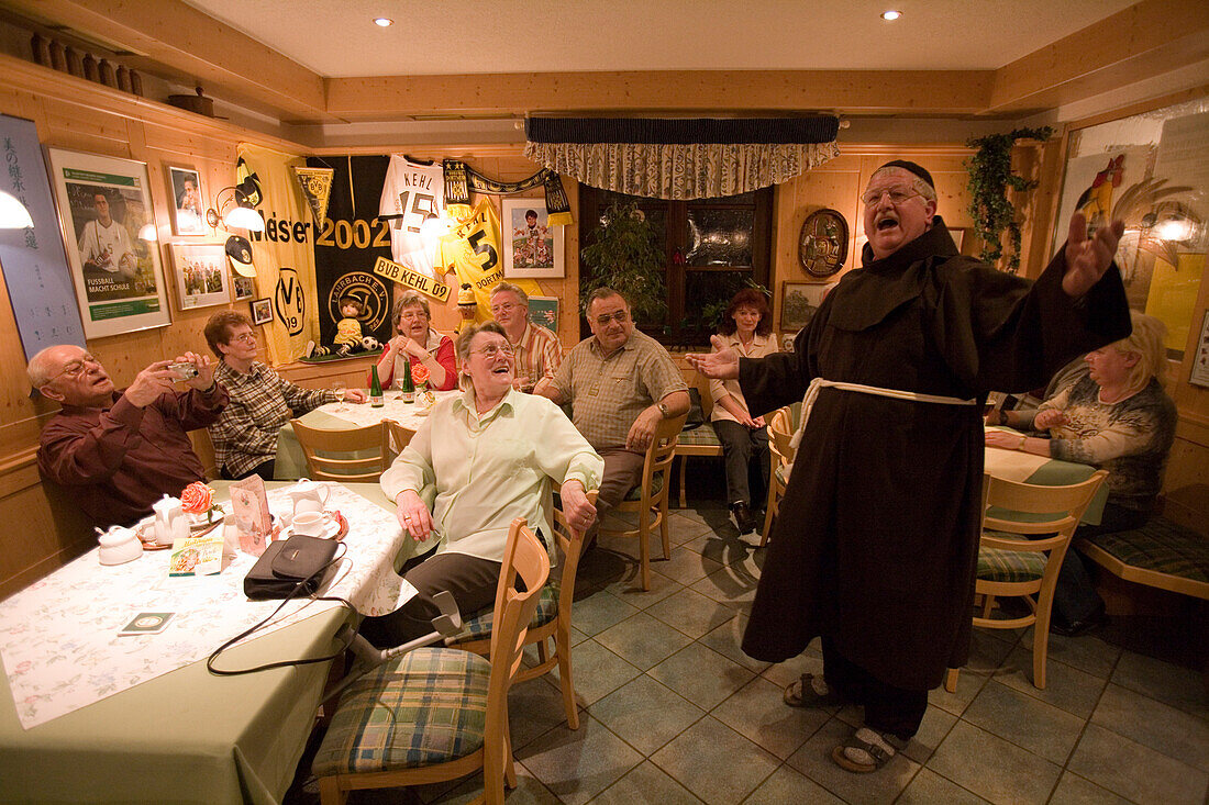 Monk Serenading at an inn,Landgasthof Kehl, Tann-Lahrbach, Rhön, Hessen, Germany