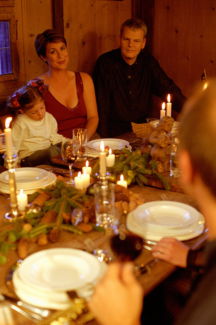 People having christmas dinner in traditional dinning room
