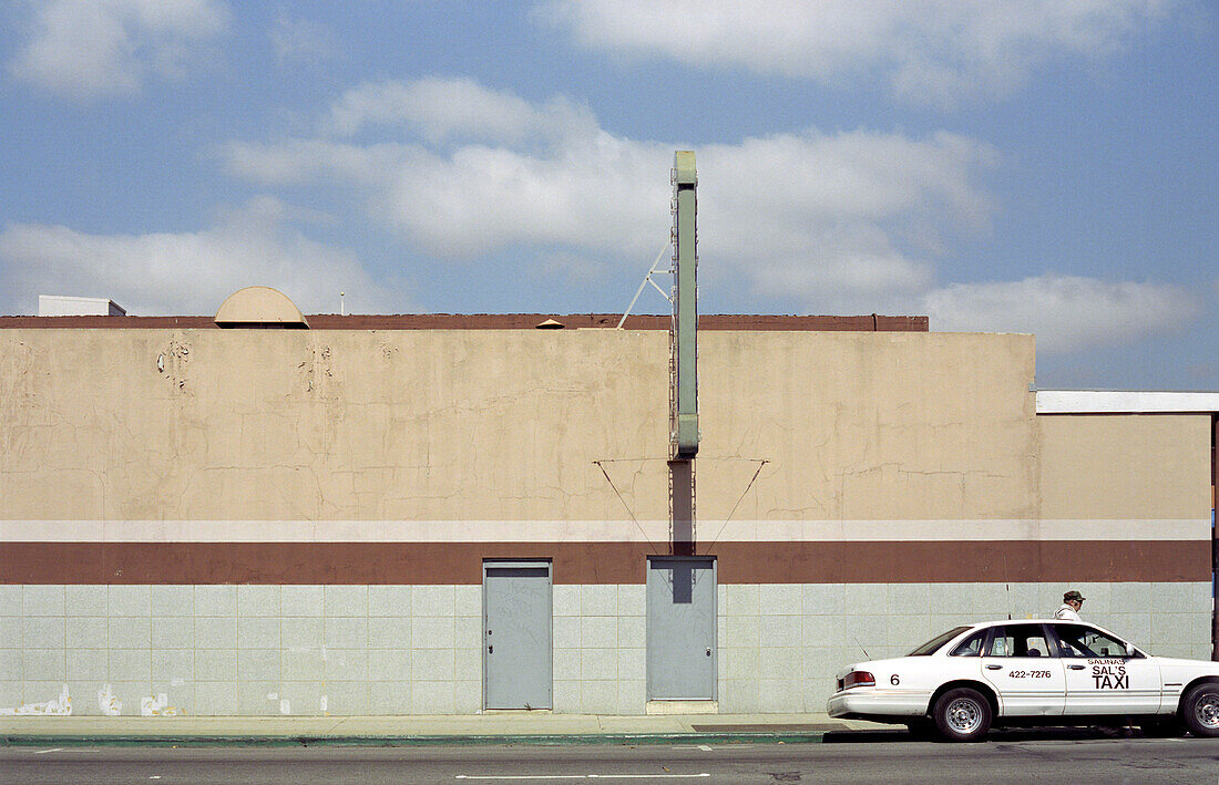 A taxi stopping at a greyhound bus station, Salinas, California, USA