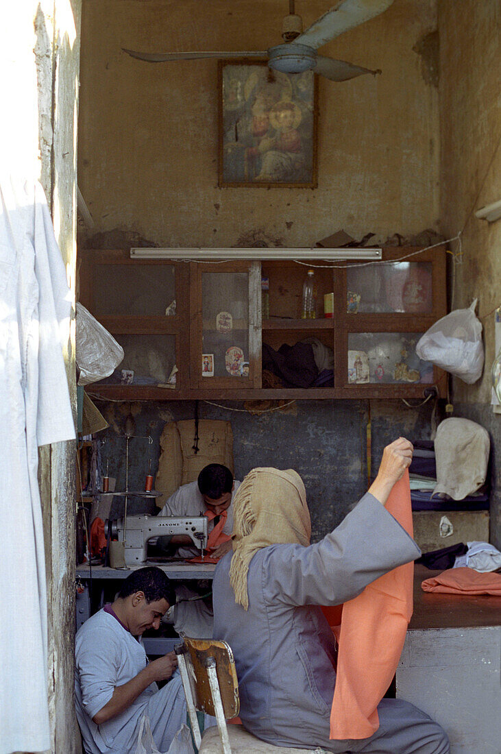 People working at a tailor shop, Luxor, Egypt