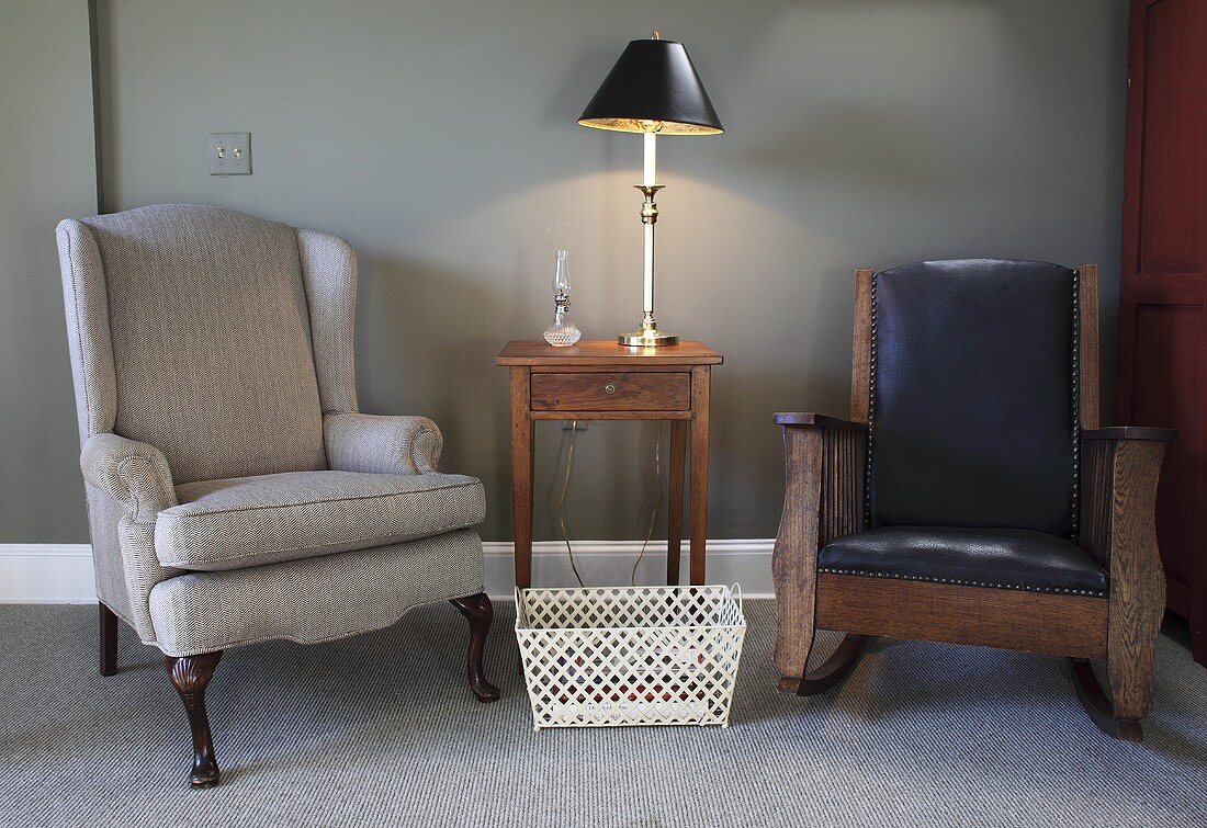 Two armchairs and a side table with a lamp