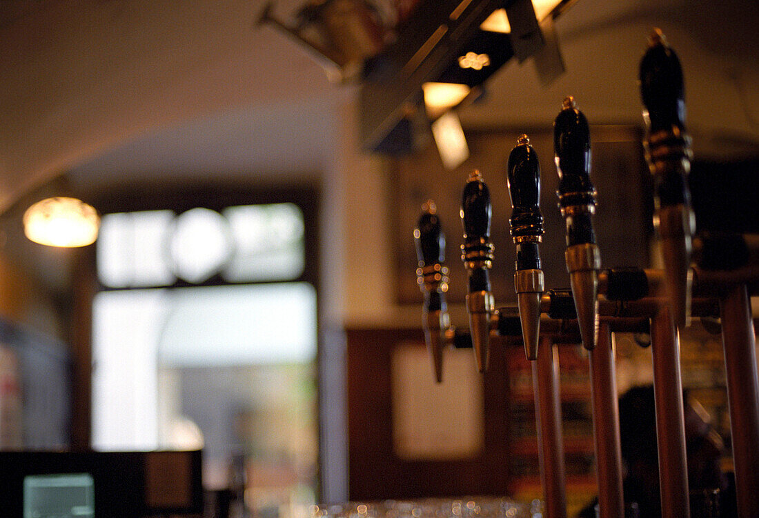 beer taps, pub bozen, bolzano, south tyrol, italy