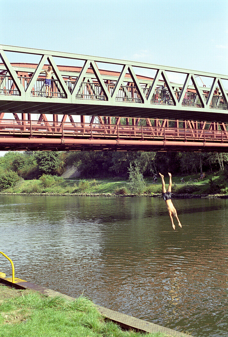 Young people diving into river, Rhine, Essen, North Rhine-Westfalia, Germany