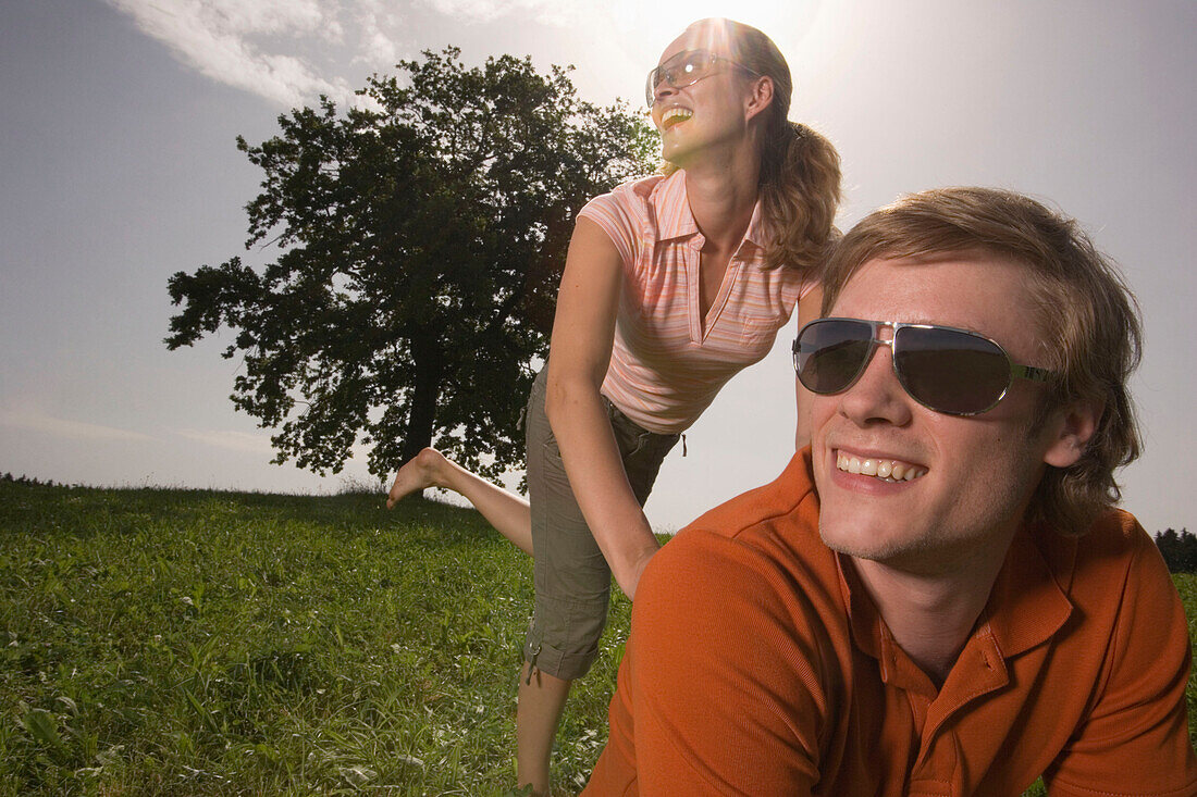 Couple having fun on meadow