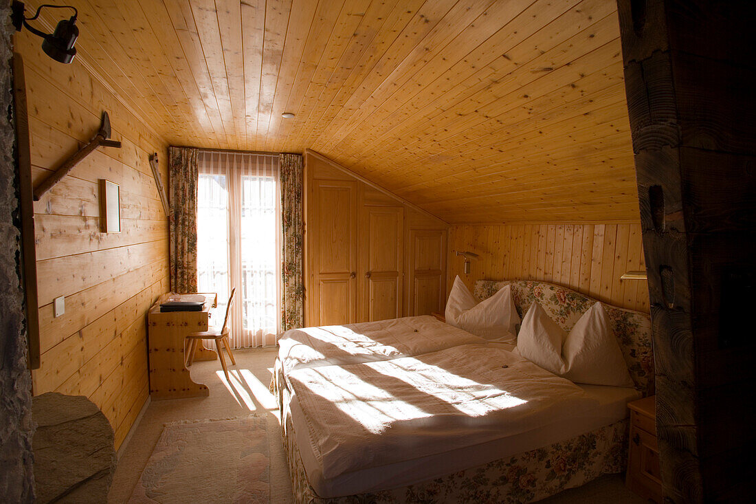 View inside the rustic double bedroom "Dom" of the Hotel and Restaurant Hohnegg, Saas-Fee, Valais, Switzerland