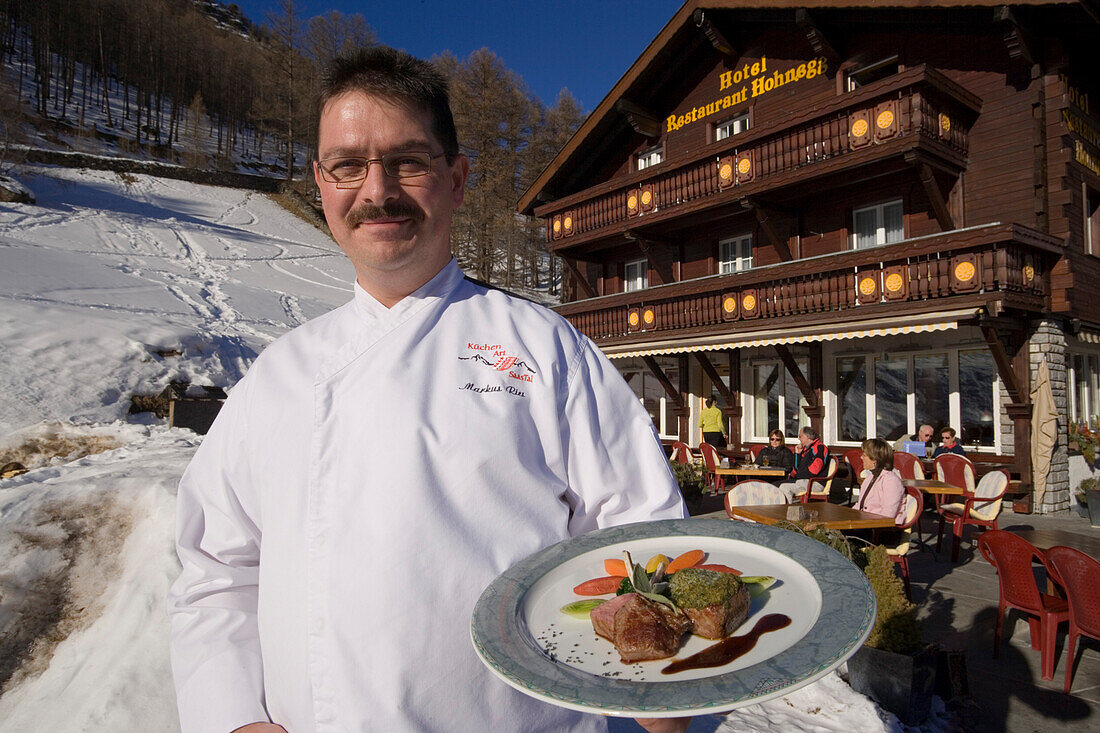 Chef Markus Riess serving a meal, Hotel and Restaurant Hohnegg, Saas-Fee, Valais, Switzerland