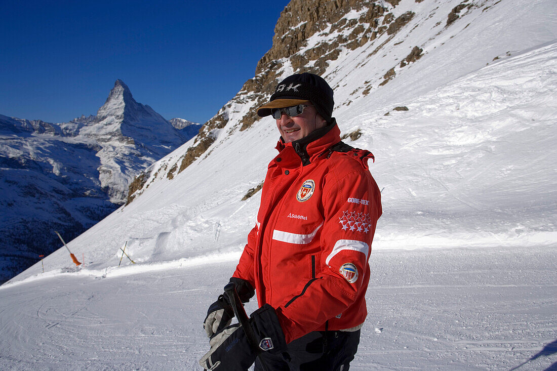 Ski instructor on mountain slope, Matterhorn (4478 m) in background, Rothorn, Zermatt, Valais, Switzerland