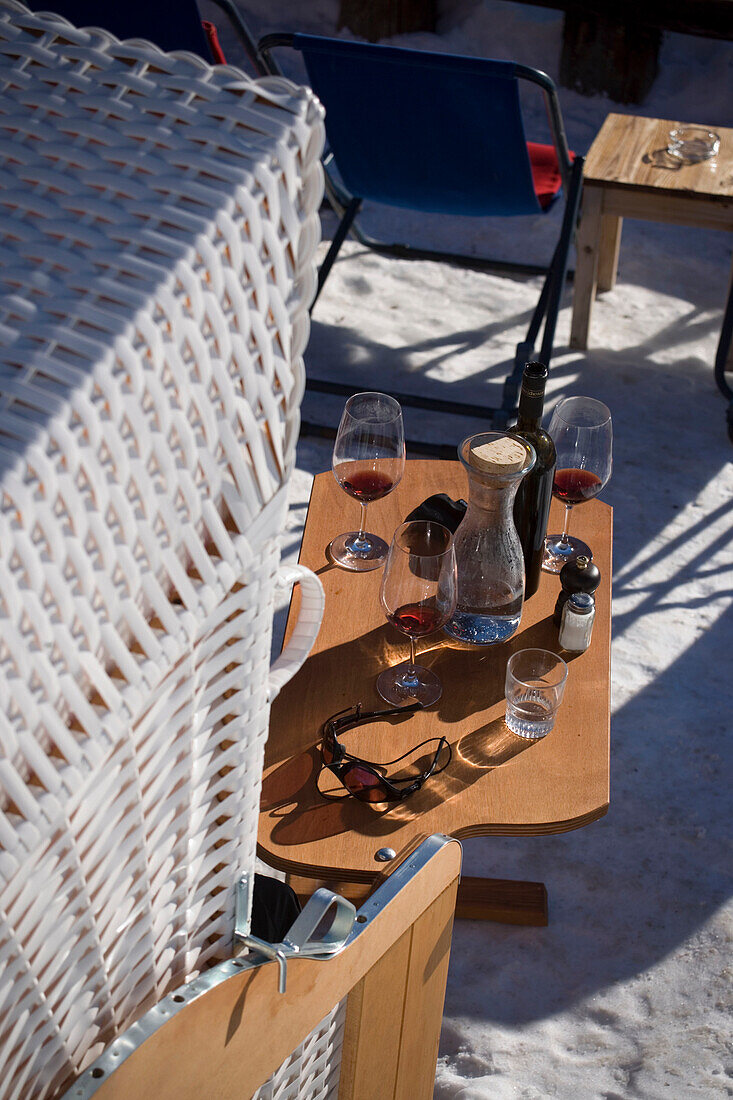 View on a table with wine glasses and bottles, Restaurant Paradies, Findeln, Zermatt, Valais, Switzerland