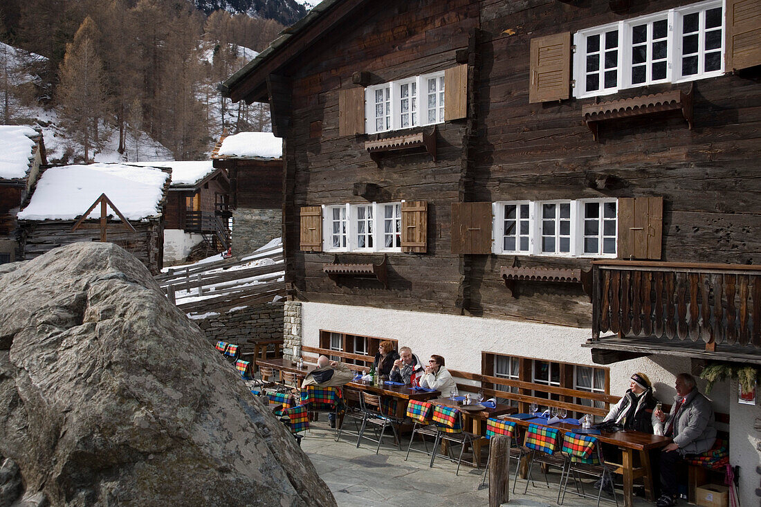 People resting on terrace of Restaurant Zum See, Zermatt, Valais, Switzerland