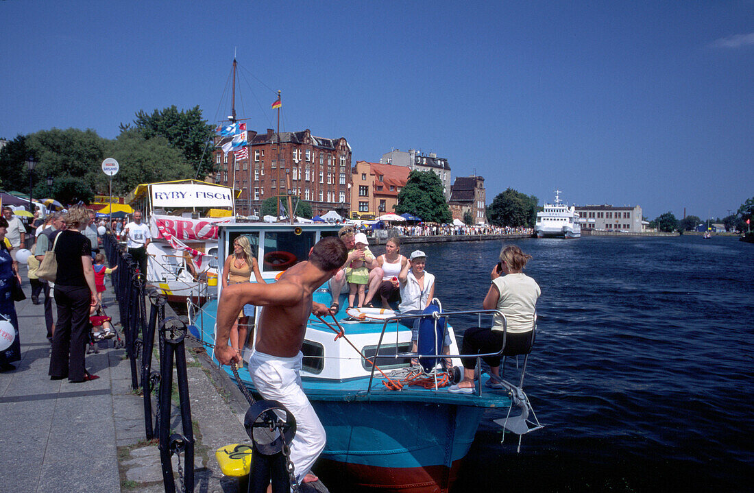 Tourists near Motlawa River in Gdansk, Danzig, Poland