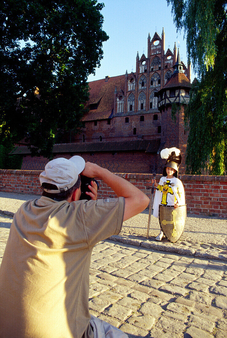 Tourists in Castle of the Teutonic Knights in Malbork (13th - 14th century), Poland