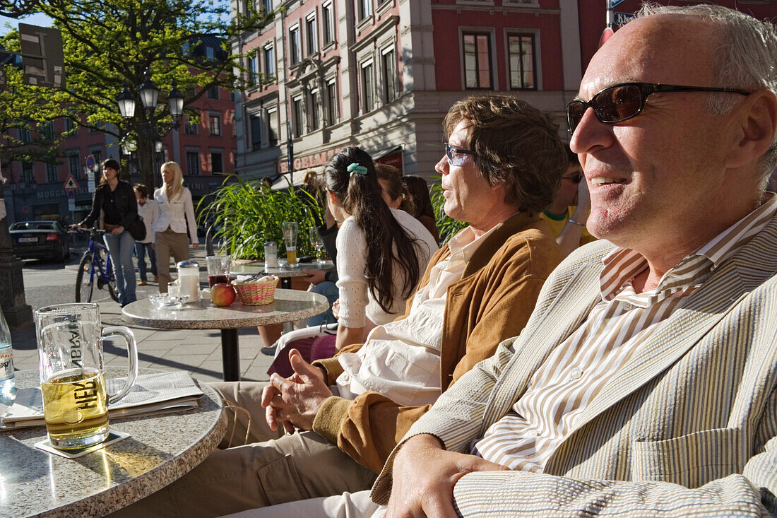 People in streetcafe Interview, Gaertnerplatz, Munich, Bavaria, Germany