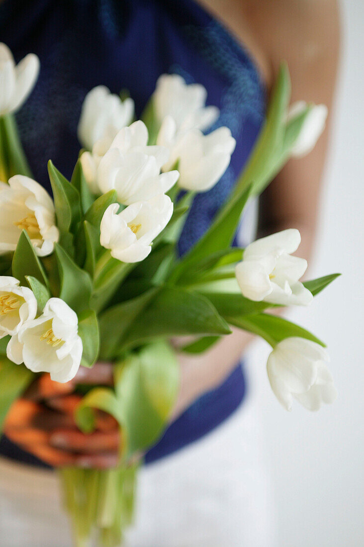 Woman with bunch of tulips