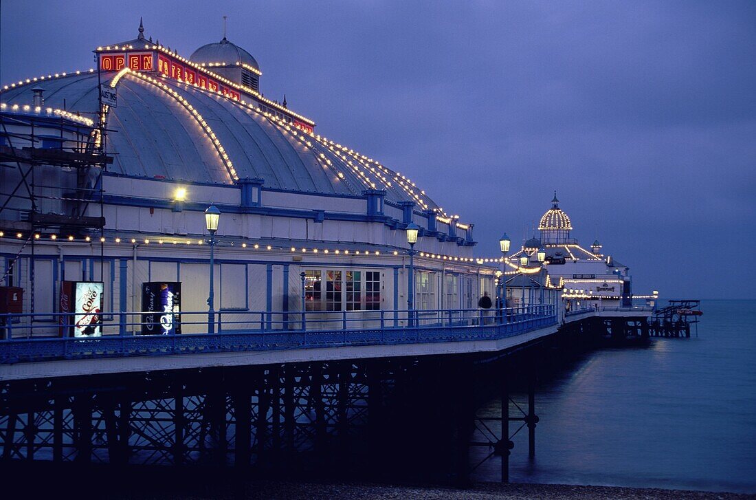 Pier and beach at night, Eastbourne, England