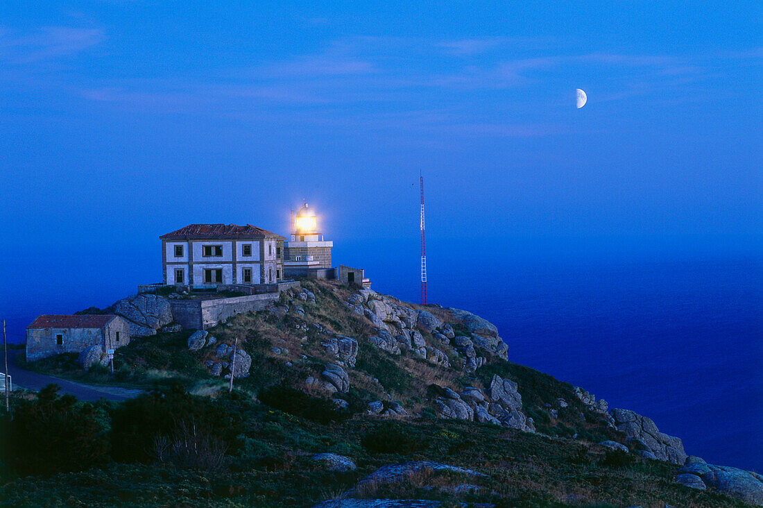 Lighthouse and moon,Cabo Finisterre,Province La Coruna,Galicia,Spain