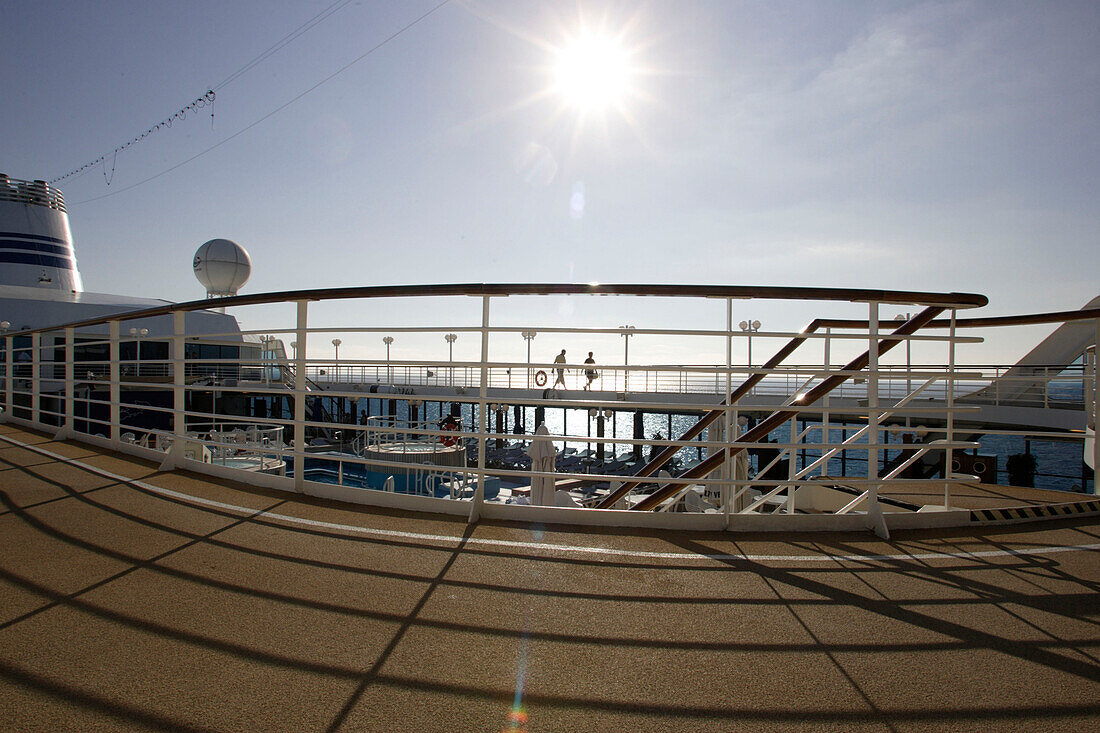 People jogging, Jogging path at the sun deck, cruise ship MS Delphin Renaissance