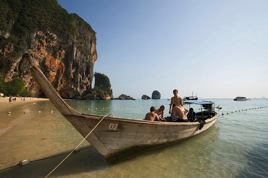 Tourists sitting in an anchored boat, Phra Nang Beach, Laem Phra Nang, Railay, Krabi, Thailand, after the tsunami