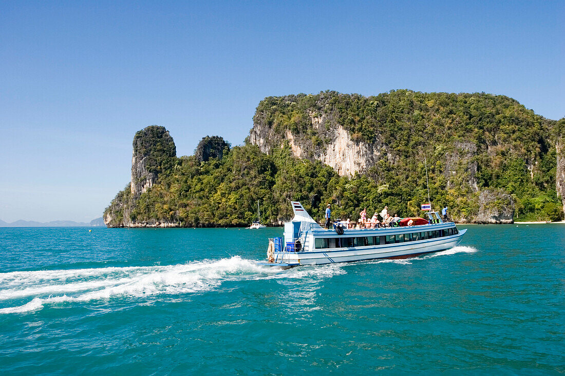 Excursion boat passing Koh Hong, Hong Island, Krabi, Thailand