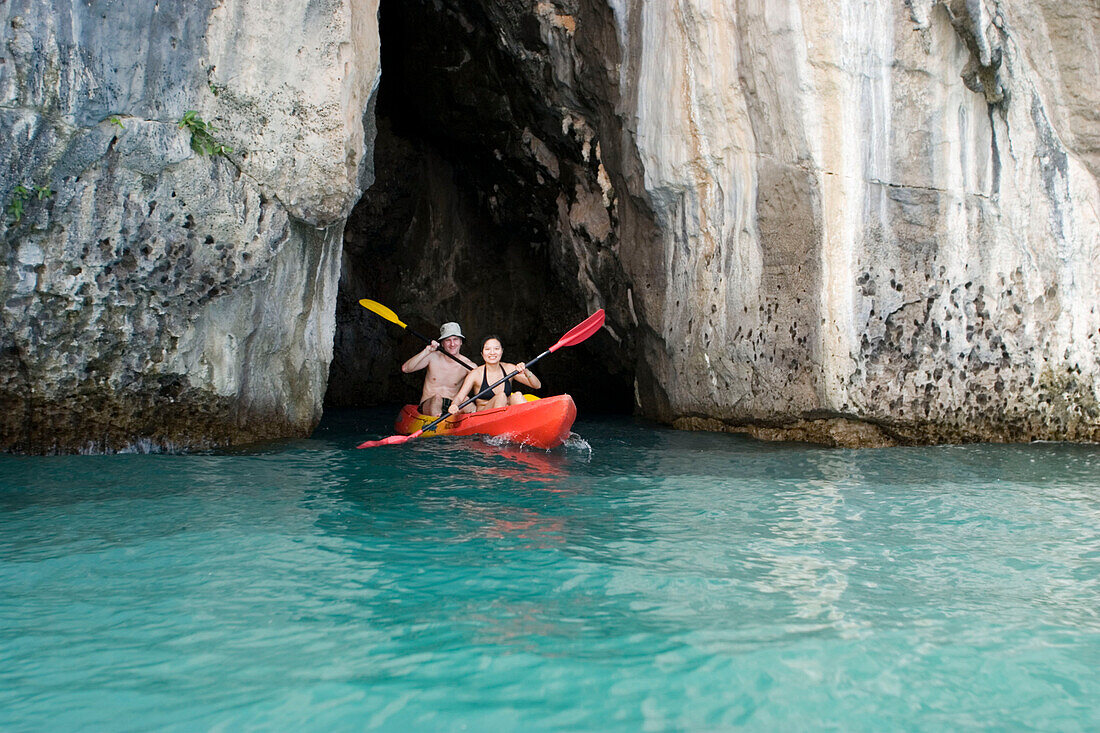 Couple kayaking, Ko Hong Island lagoon, Phang Nga bay, Krabi, Thailand, after the tsunami