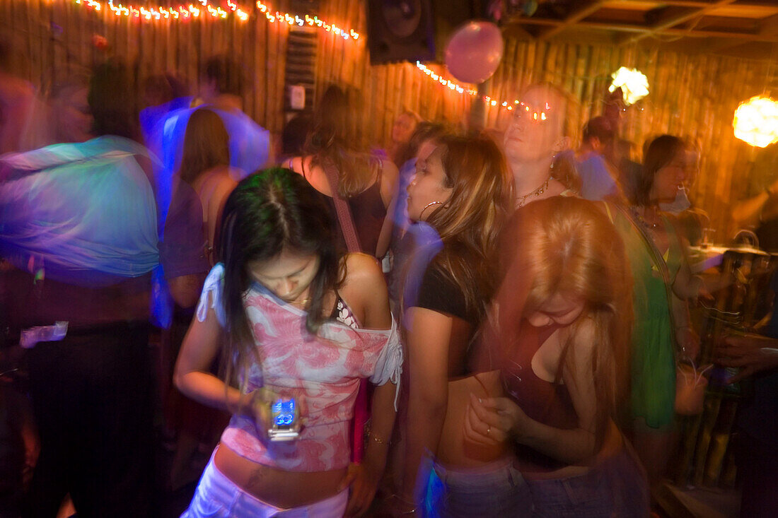 Phonmng, Girls dancing in a bar, Ko Phi Phi Don, Ko Phi Phi Island, Krabi, Thailand, after the tsunami