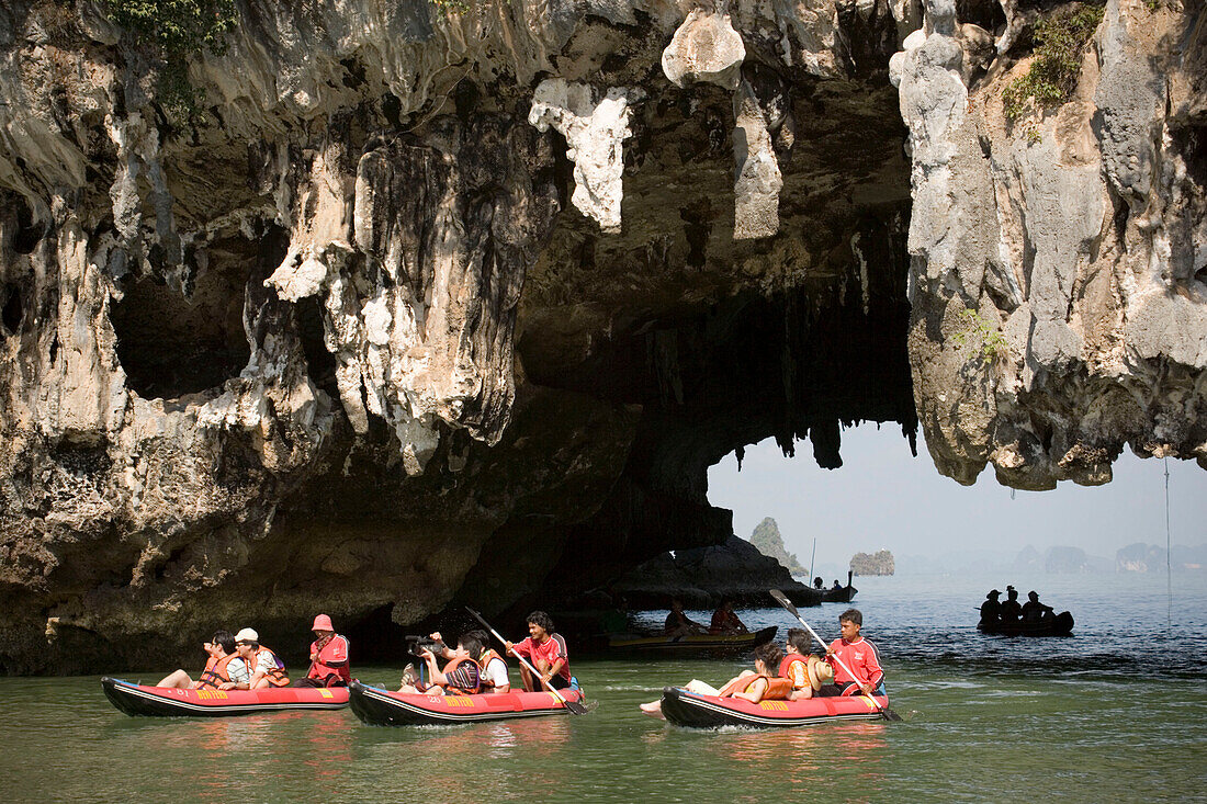 Group of tourists kayaking, passing a Karst formation, Phang-Nga Bay, Ao Phang Nga Nation Park, Phang Nga, Thailand