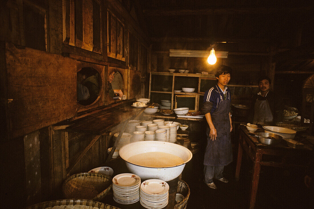 Men at the canteen of the Xixiang Chi monastery, Emei Shan, Sichuan province, China, Asia