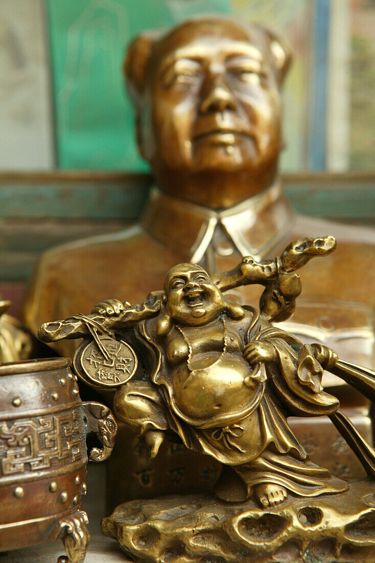 Bust of Mao and laughing Buddha statue at a souvenir shop, Heng Shan, China, Asia