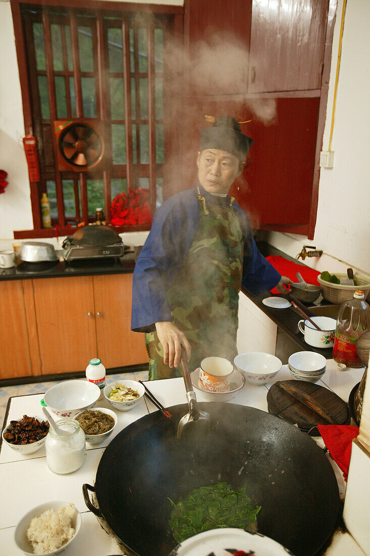 kitchen, cooking with wok, Huangting convent, nunnery, Heng Shan south, Hunan province, Hengshan, Mount Heng, China, Asia
