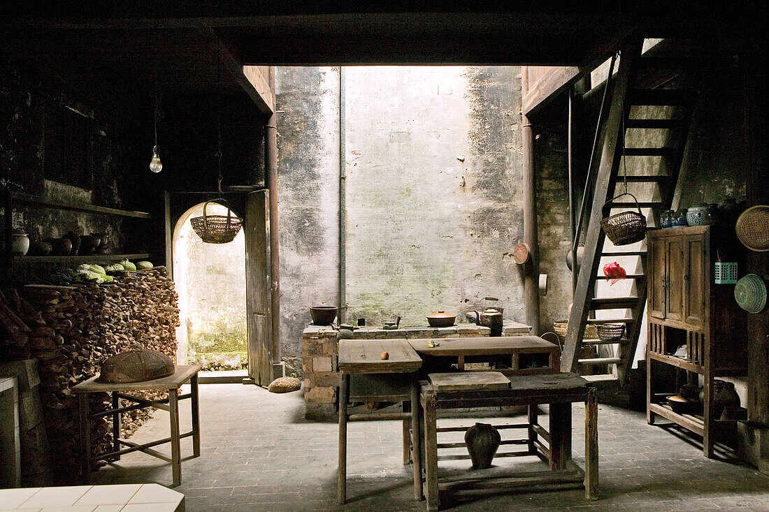 Interior view of a traditional kitchen at an old timber house in Chengkun, Hongcun, China, Asia