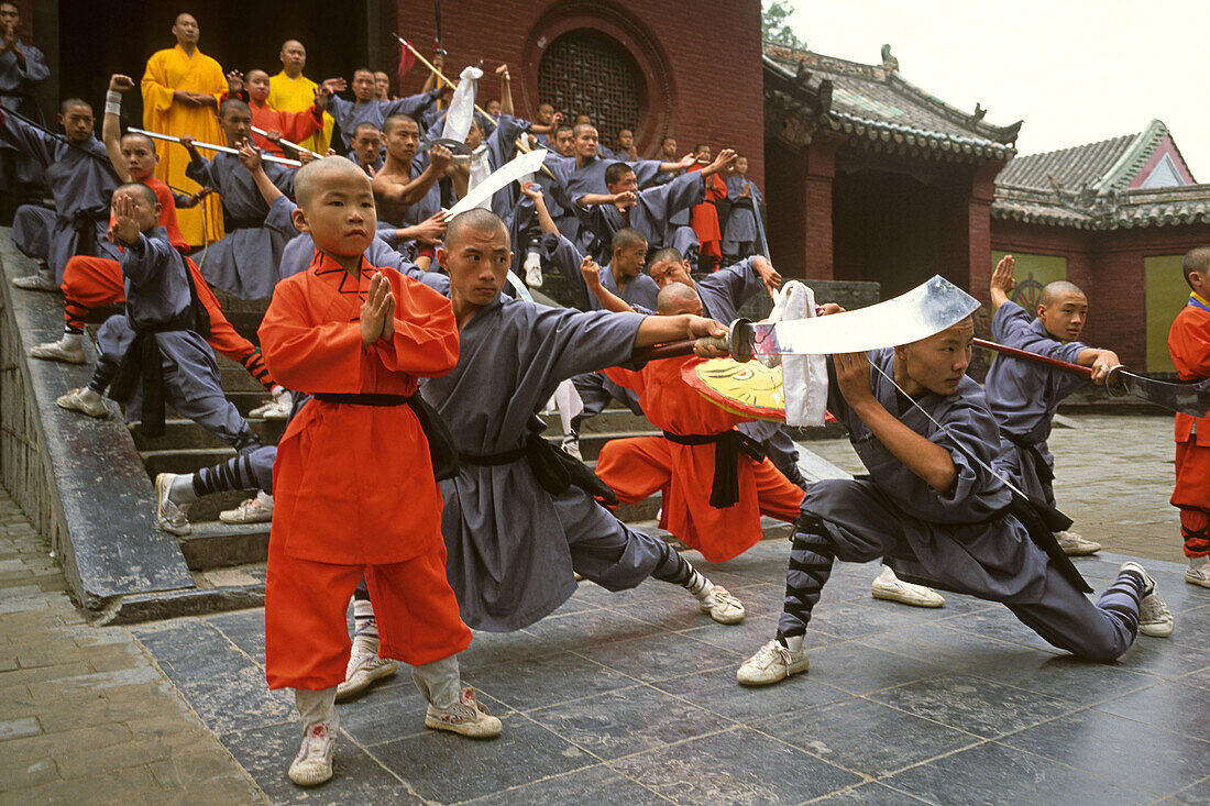 Shaolin Buddhist monks, Kung Fu students rehearsing for a performance on Buddhas birthday, Shaolin Monastery, known for Shaolin boxing, Taoist Buddhist mountain, Song Shan, Henan province, China