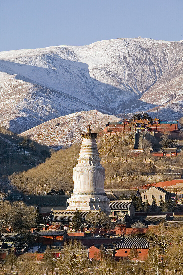 Mountains of  Wutai Shan in winter snow, Five Terrace Mountain, Great White Pagoda, Northern Terrace, Buddhist Centre, town of Taihuai, Shanxi province, China, Asia