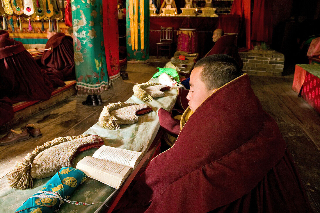 Prayer ceremony in Pusa Ding monastery, yellow cap monks, Wutai Shan, Five Terrace Mountain, Buddhist Centre, town of Taihuai, Shanxi province, China