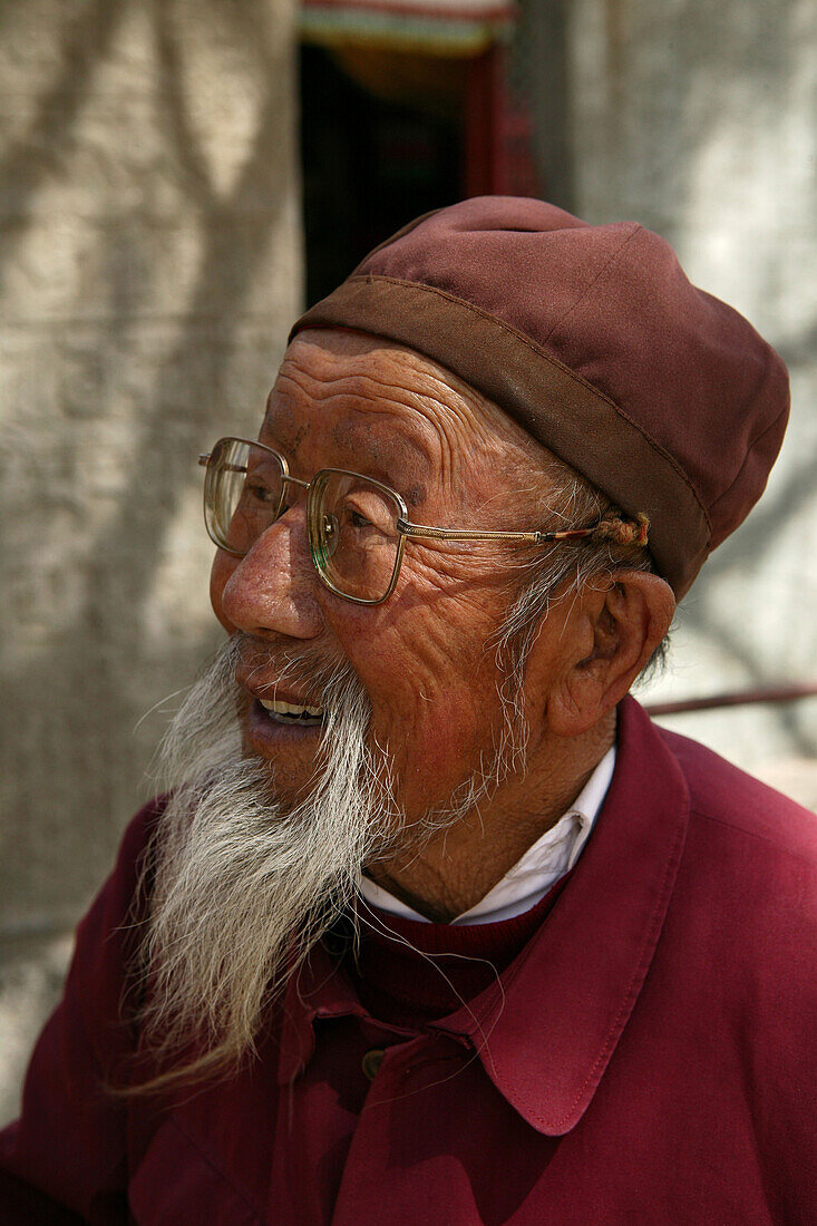 Elderly bearded monk with glasses, Taihuai, Mount Wutai, Wutai Shan, Five Terrace Mountain, Buddhist Centre, town of Taihuai, Shanxi province, China