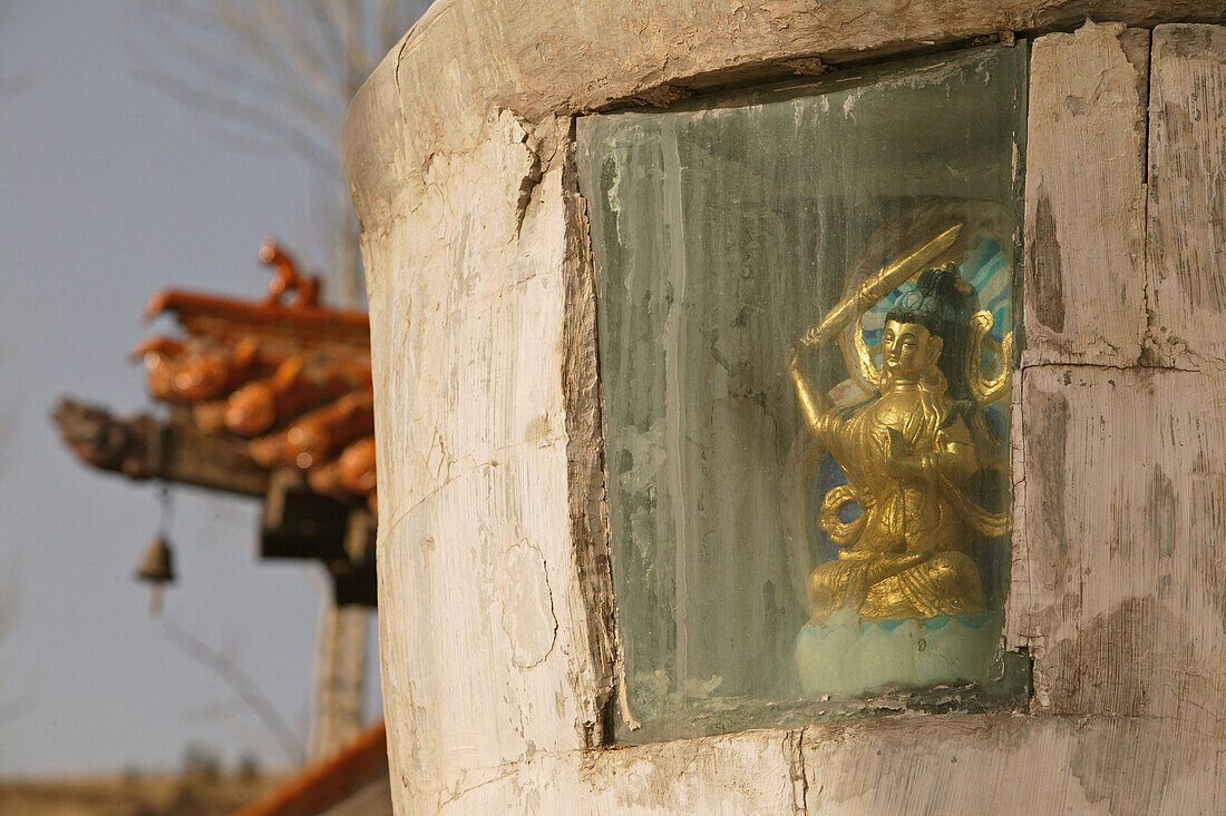 Buddha statue in a stupa in the courtyard of Santa Monastery, Mount Wutai, Wutai Shan, Buddhist holy Mountain, Shanxi province, China
