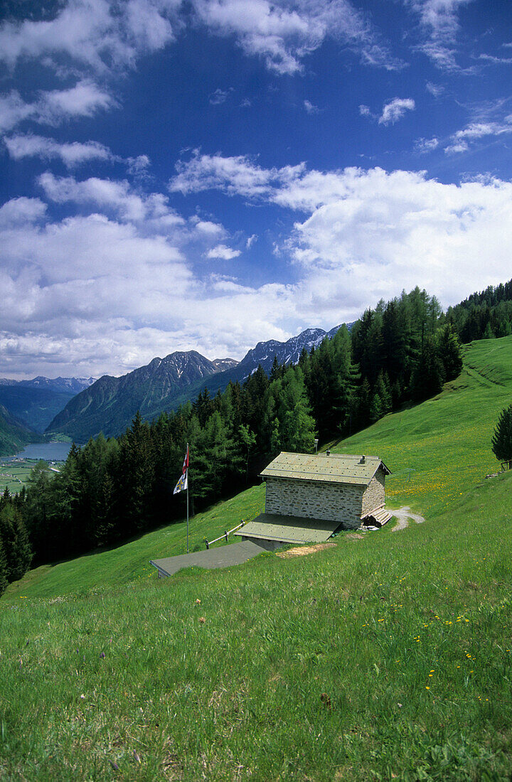 alpine hut in Braita above the valley of Puschlav and lake Puschlav, Puschlav, Grisons, Switzerland