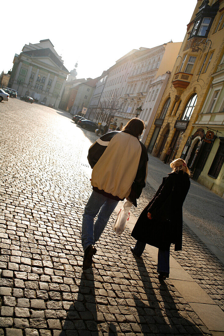 Couple walking over Ovocny Trh Square, Stare Mesto, Old Town, Prague, Czech Republic