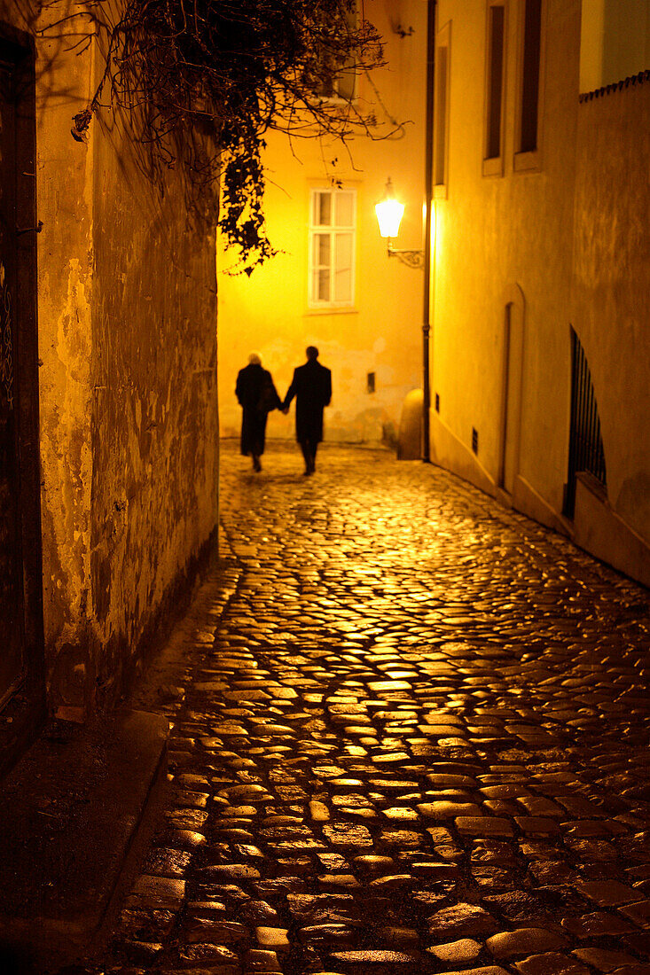 Couple walking down an alley, Mala Strana, Little Quarter, Prague, Czech Republic