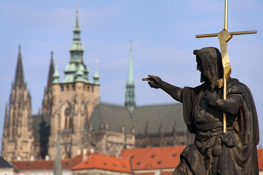 Close up of a statue of St John the Baptist on Charles Bridge, Prague Castle, Prague, Czech Republic