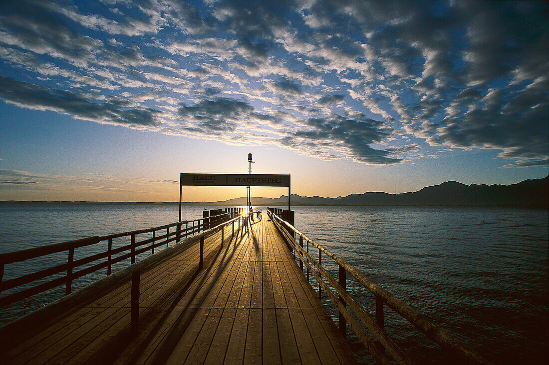 The main pier in the morning light, Fraueninsel, Lake Chiemsee, Bavaria, Germany