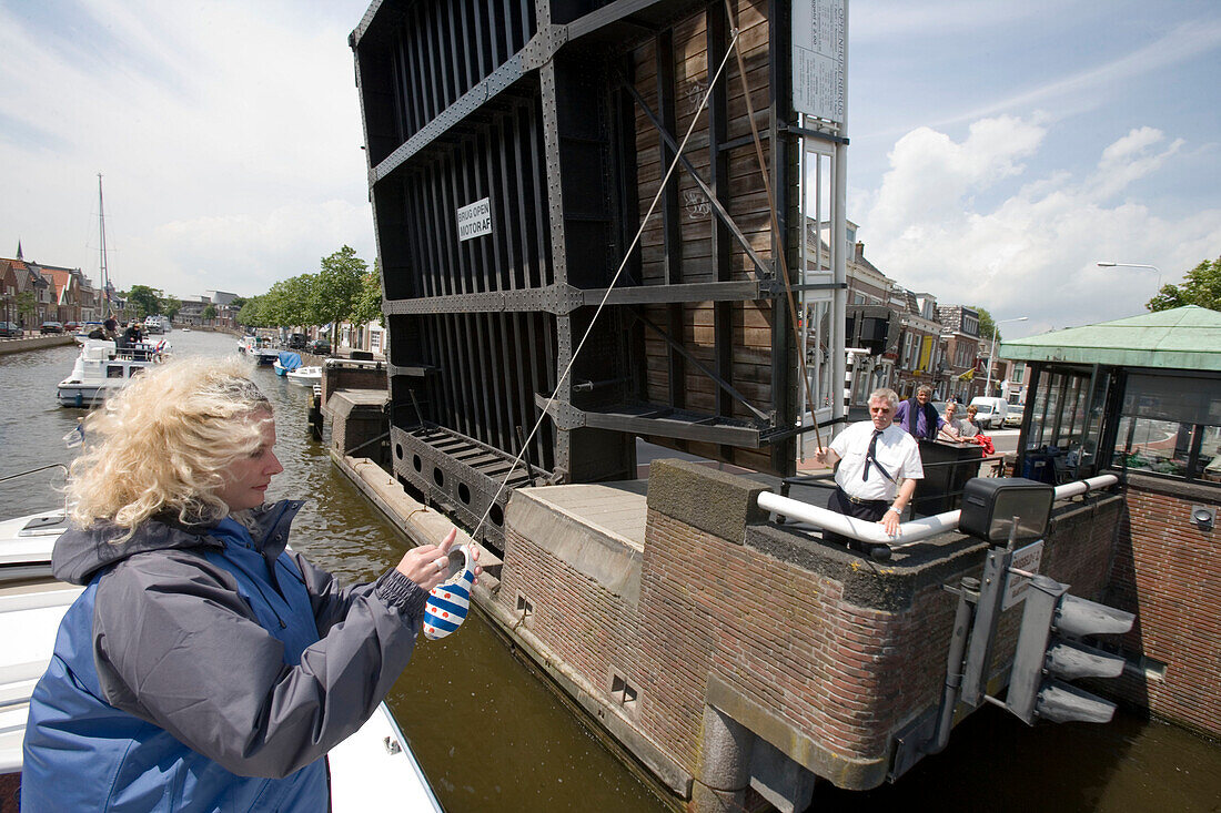 Collecting Drawbridge Toll in a clog, Sneek, Frisian Lake District, Netherlands