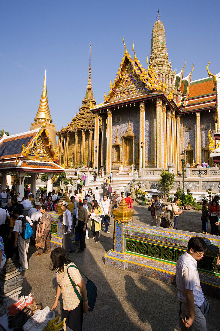 Tourists visiting Wat Phra Kaew, the most important Buddhist temple of Thailand, Ko Ratanakosin, Bangkok, Thailand