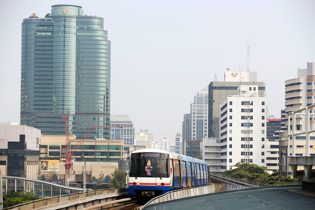 Sky Train passing Siam Square, Skyscrapers in background, Pathum Wan district, Bangkok, Thailand