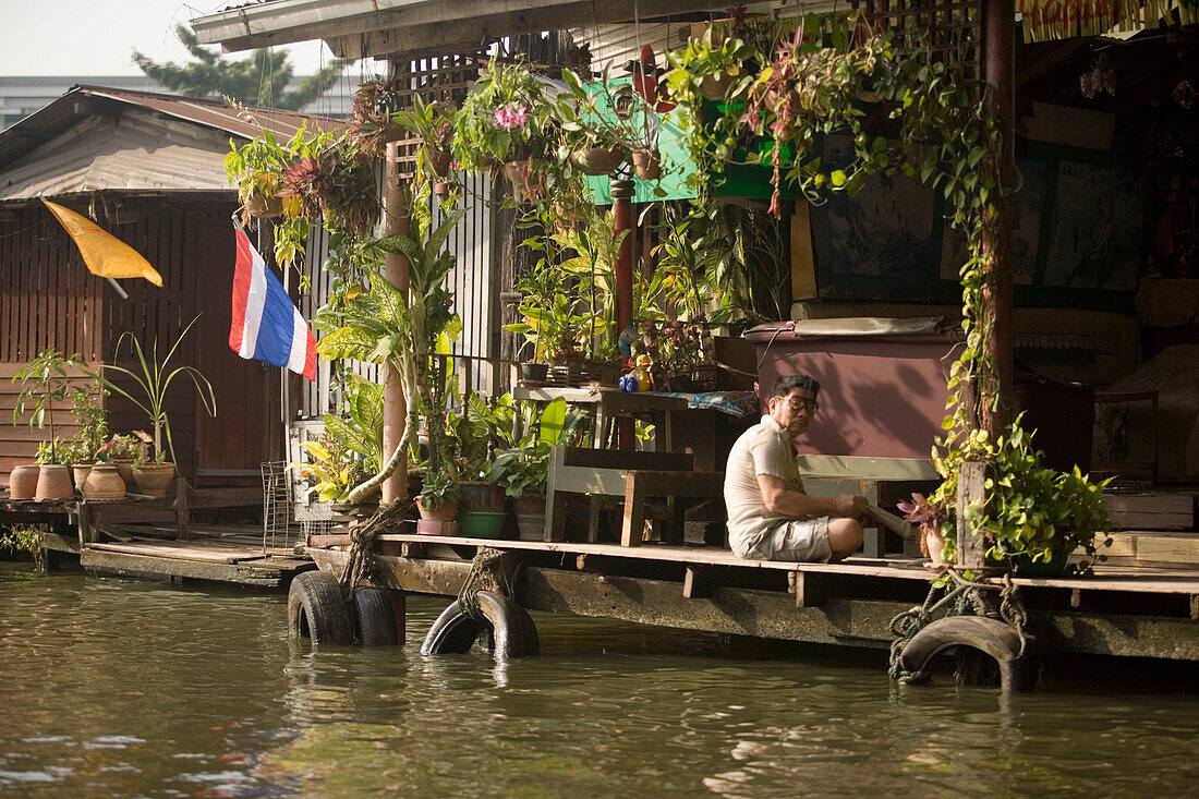 Wooden stilt houses along a Khlong, Thon Buri, Bangkok, Thailand