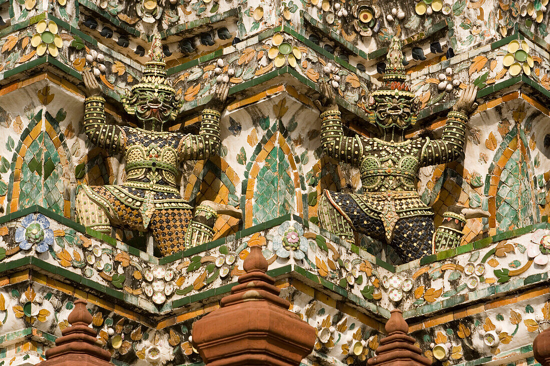 Part of Wat Arun, Temple of Dawn with demon bearers, Bangkok, Thailand