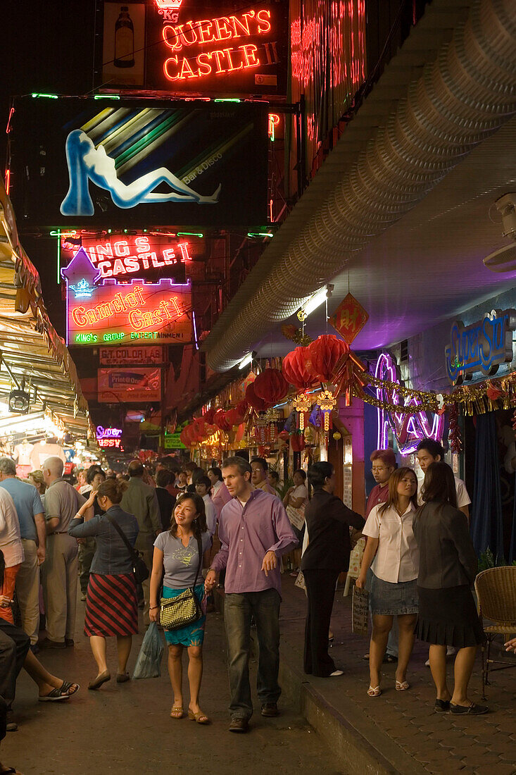 People walking over a night market along bars and clubs, Patpong, red light and entertainment district, Bang Rak district, Bangkok, Thailand