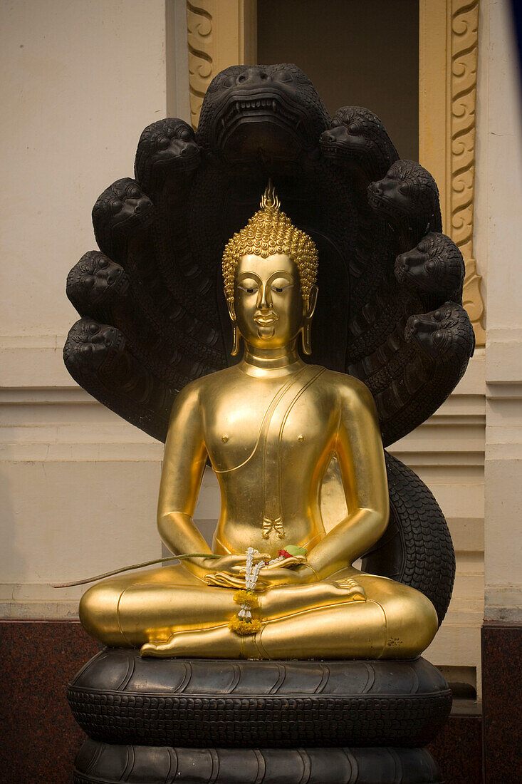 Meditating Buddha, protected by Mucalinda, Wat Suthat, Bangkok, Thailand