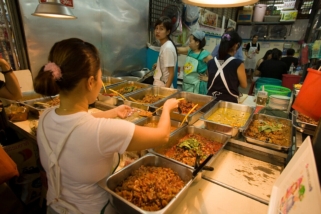 Women preparing Thai food at Suan Chatuchak Weekend Market, Bangkok, Thailand